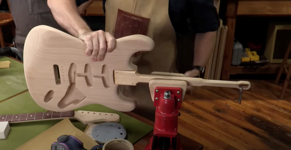 Methods for holding guitar body while sanding