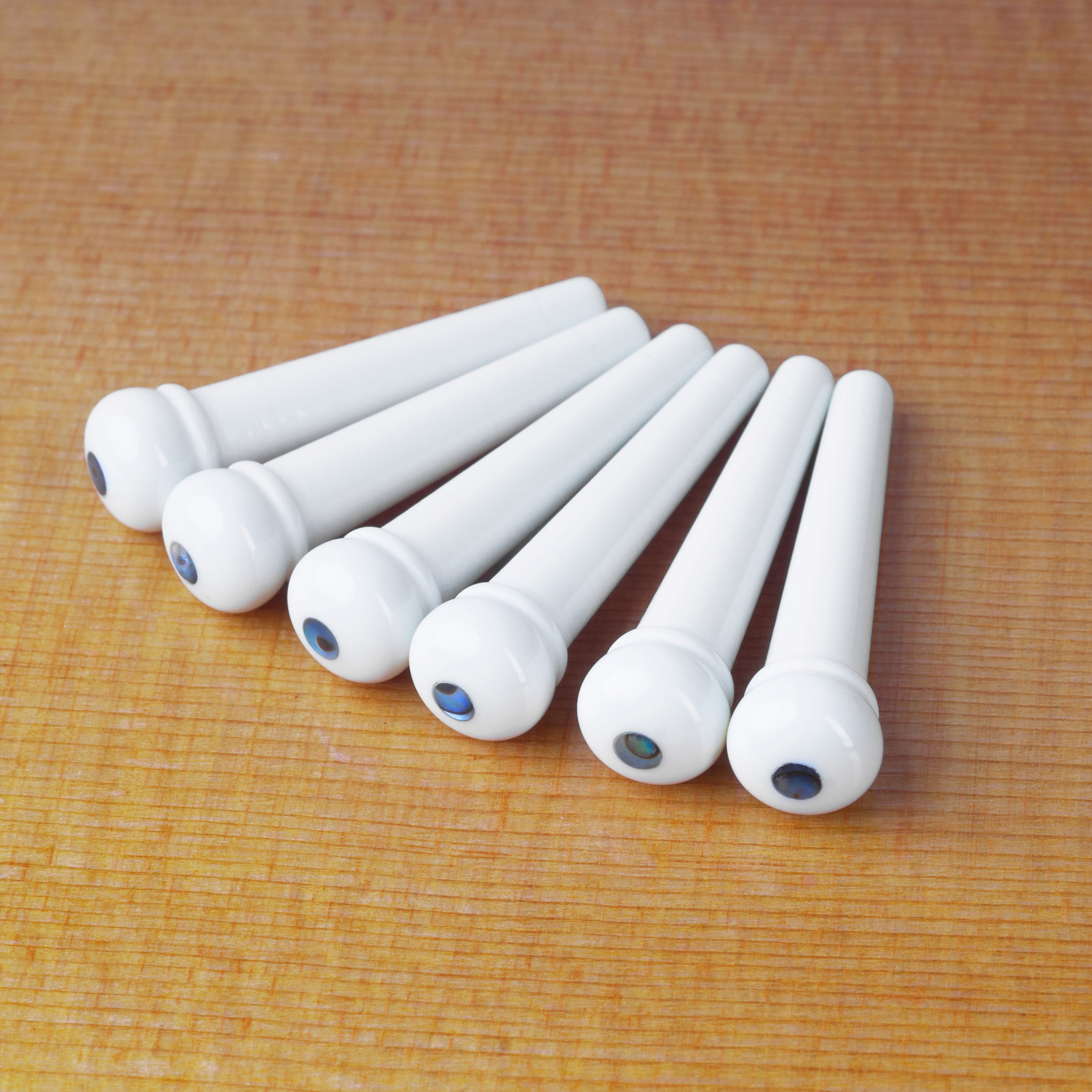 Goupilles de pont blanches ondulées avec incrustation Abalone Goupilles de pont blanches ondulées avec incrustation Abalone