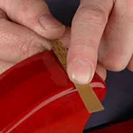 Terminer la réparation avec du papier de micro-finition