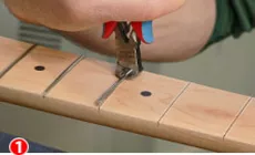 Fente de tirage des frettes