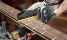 Déplacer le caul sur la frette