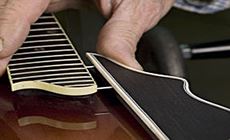 Mandolin pressing the pins