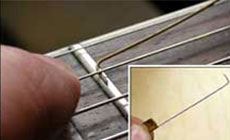 Bent string feeler gauge