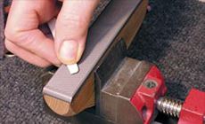 Filing the bridge saddle ends